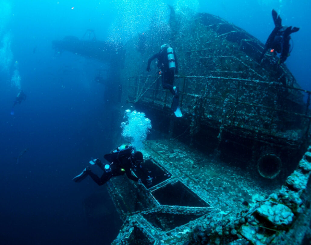 Scuba divers exploring the Oriskaney in the waters off Pensacola, Florida.