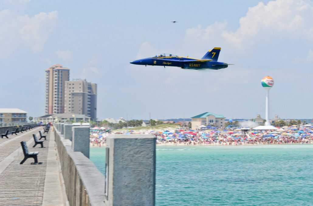 Blue Angels flying over the Pensacola Beach Pier at the Pensacola Beach Air Show.
