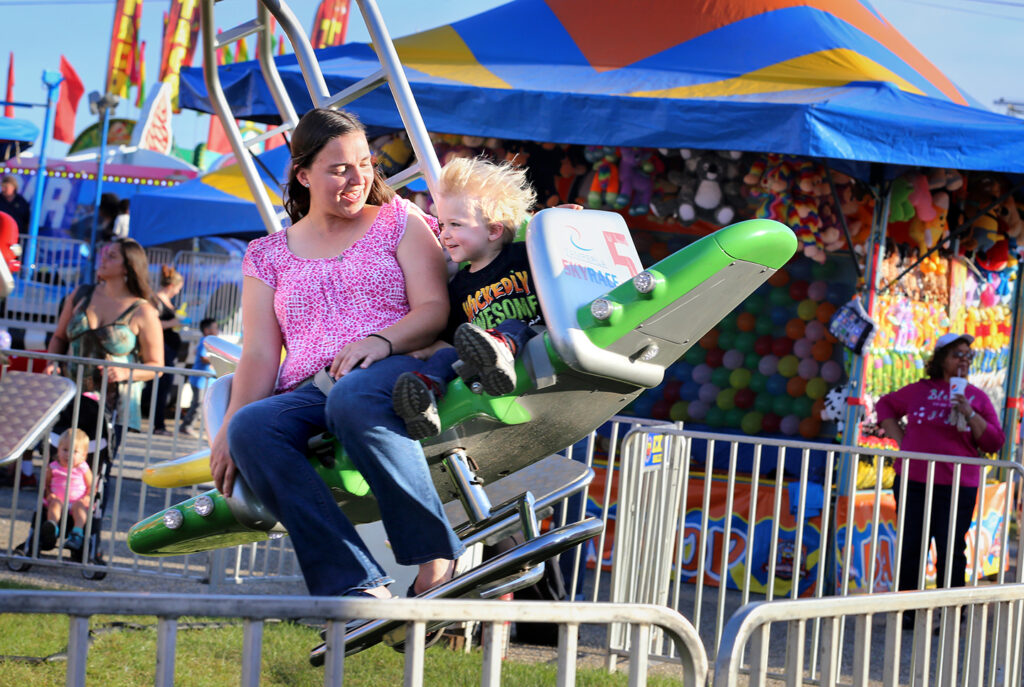 woman and child on Sky Race ride. 