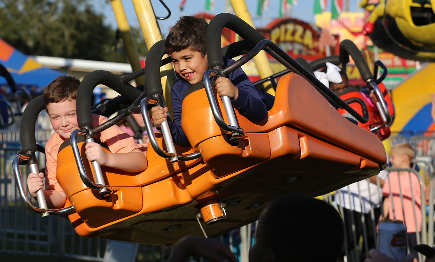 Two boys on a ride at the Fair