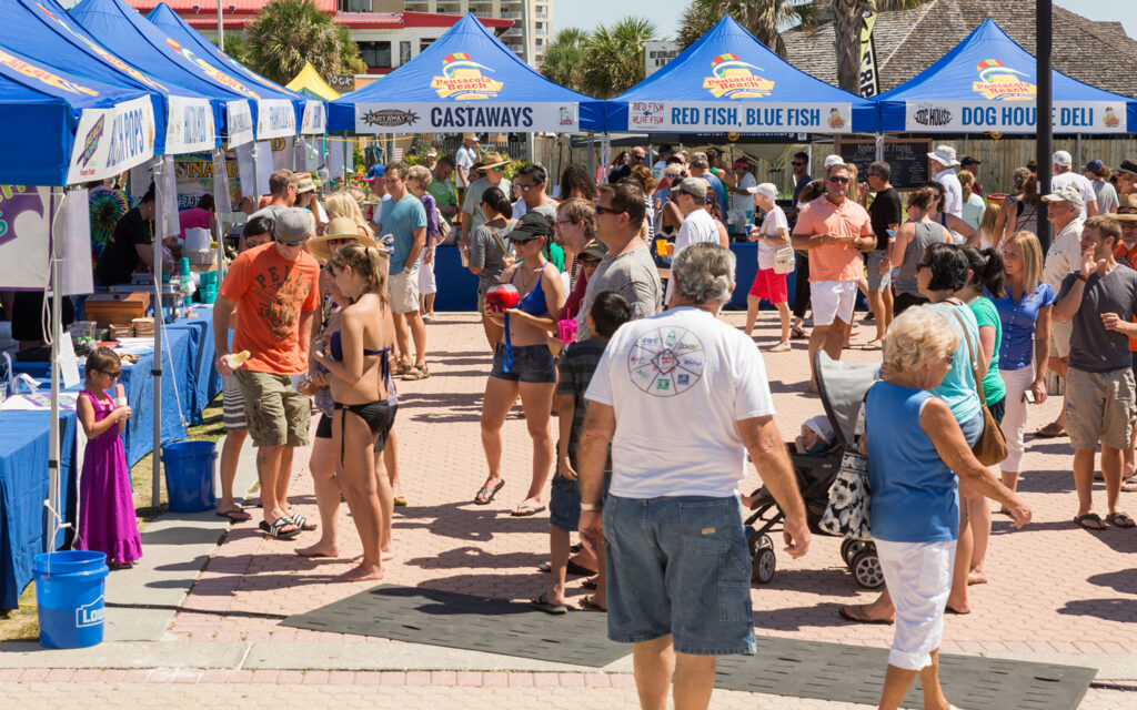 A crowd of people exploring the vendors at the Taste of the Beach festival