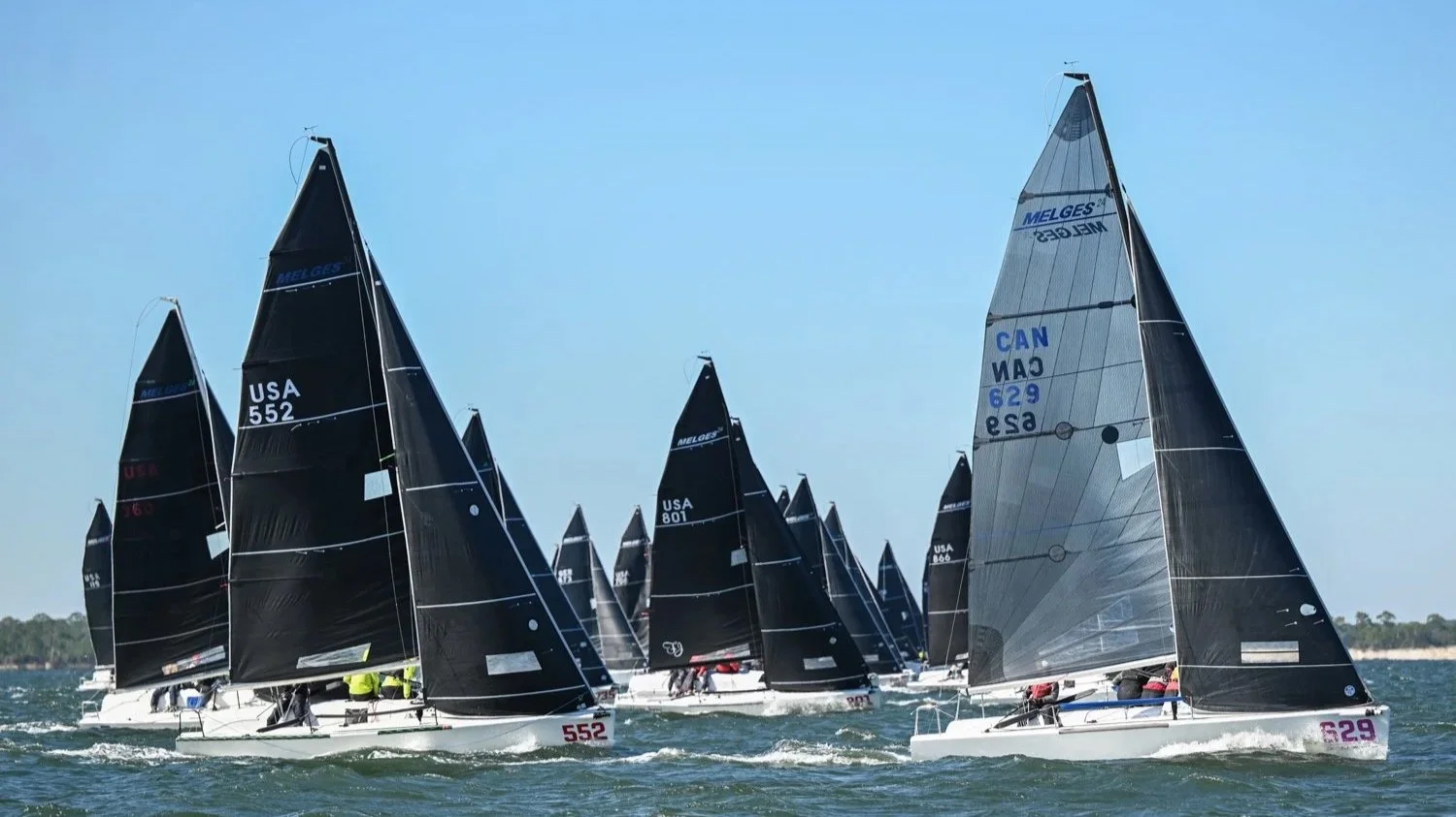 Group of Melges 24 boats sailing for the Pensacola Yacht Club National Championship in Pensacola
