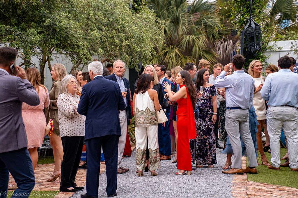 A crowd of people mingling outside at the Fork Cancer Gala