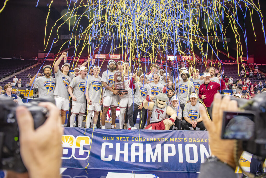 The Troy Men's basketball team celebrating their win at the 2026 Sun Belt Conference. 
