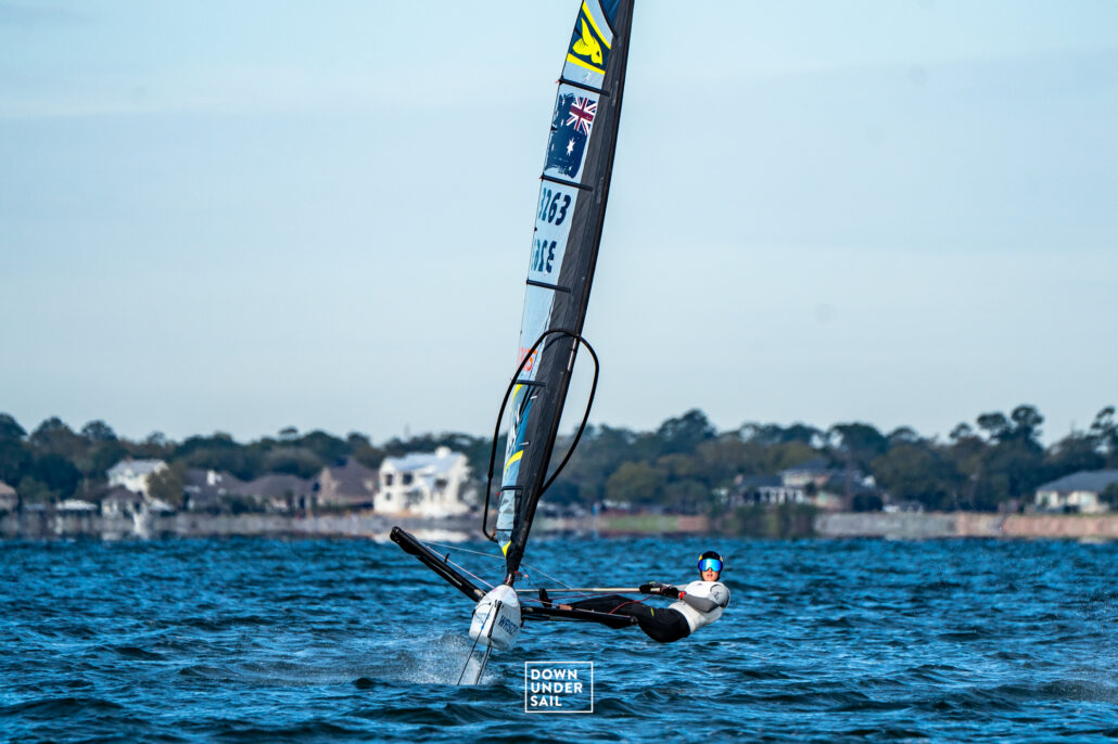 Person sailing a WASZP boat on Pensacola Bay.